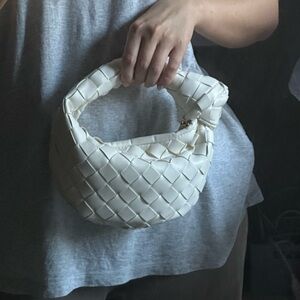 Ivory weave faux leather bag with red inside